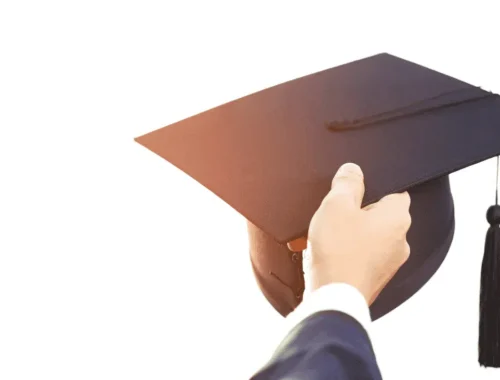 Graduate man in cap and gown, representing the 8 secret tips of toppers every student deserves to know