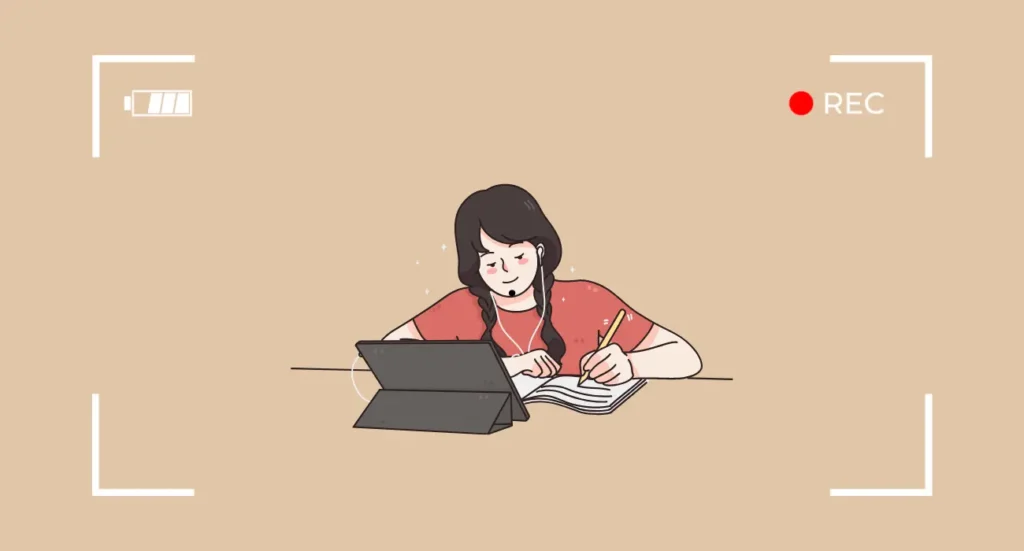 A girl sitting at a desk, focused on studying and recording herself