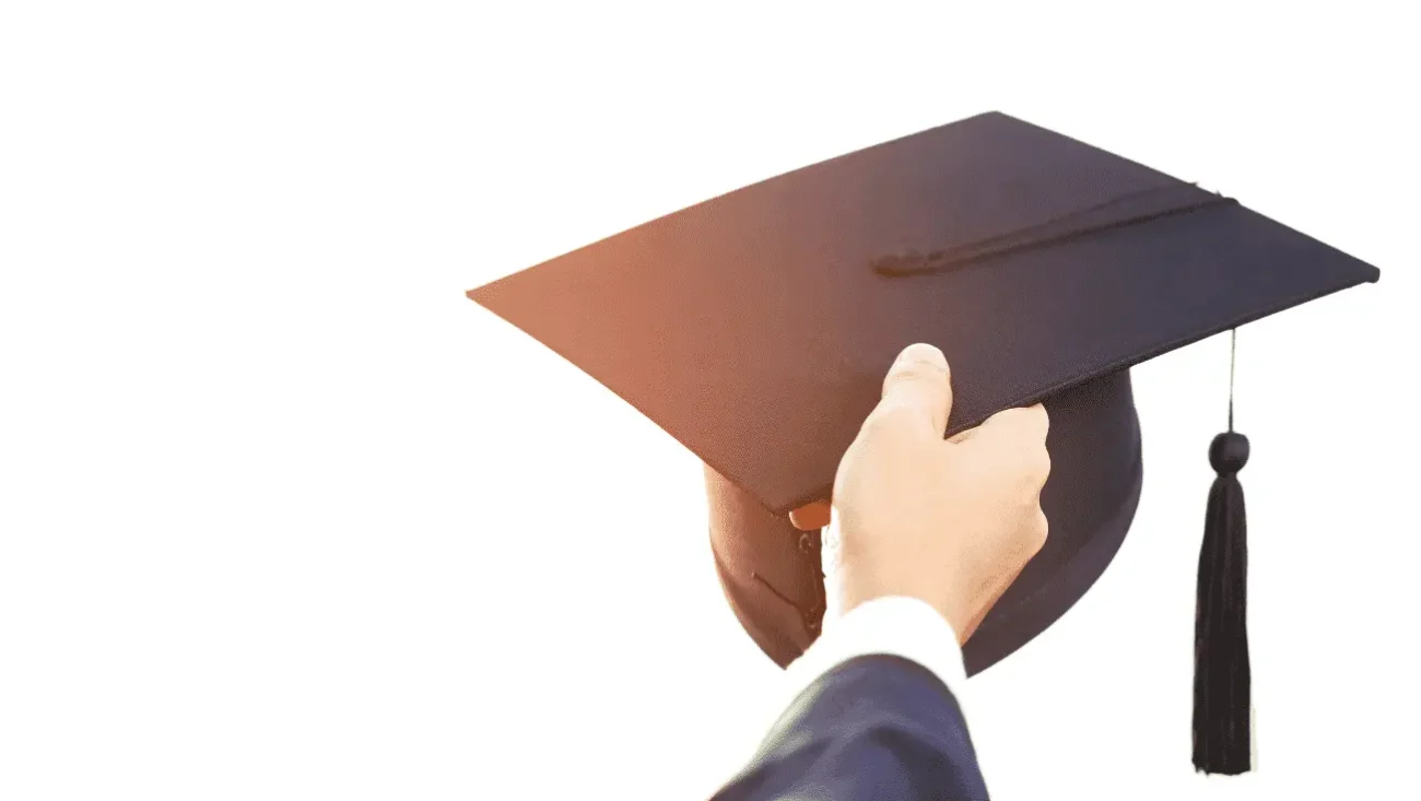 Graduate man in cap and gown, representing the 8 secret tips of toppers every student deserves to know